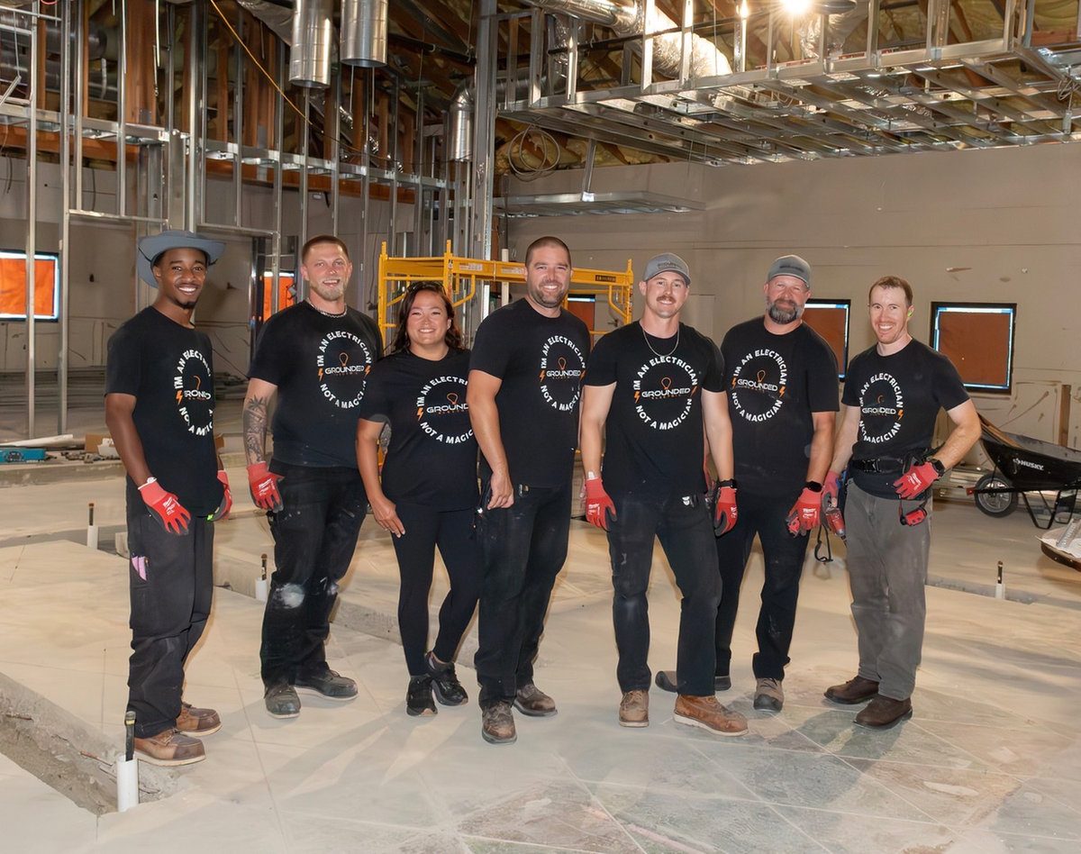 The full Grounded Electric team on a commercial job site